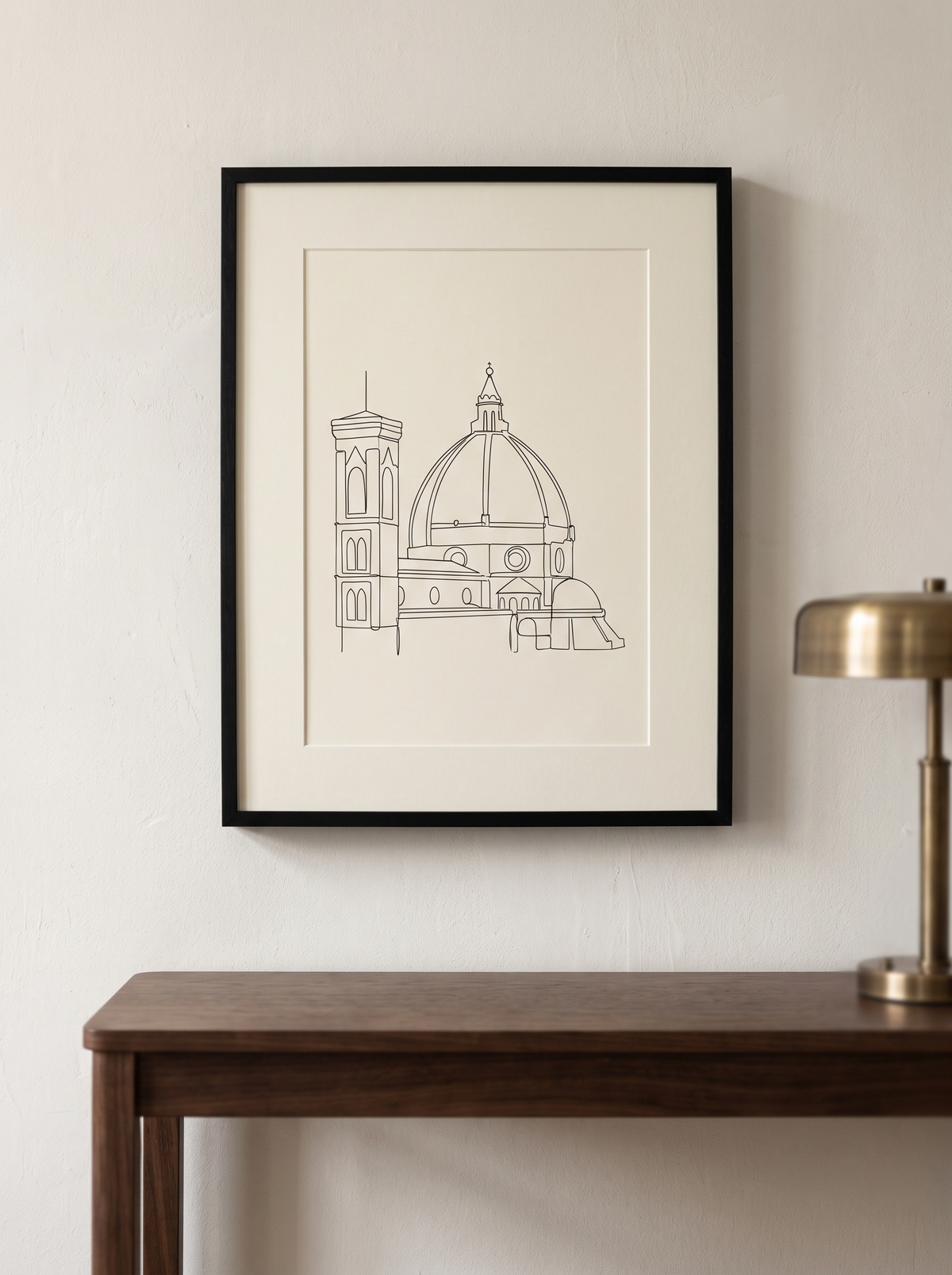 Stampa incorniciata Duomo Line Art, disegno a linea continua nera su carta avorio in cornice sottile nera, appesa sopra una consolle in noce